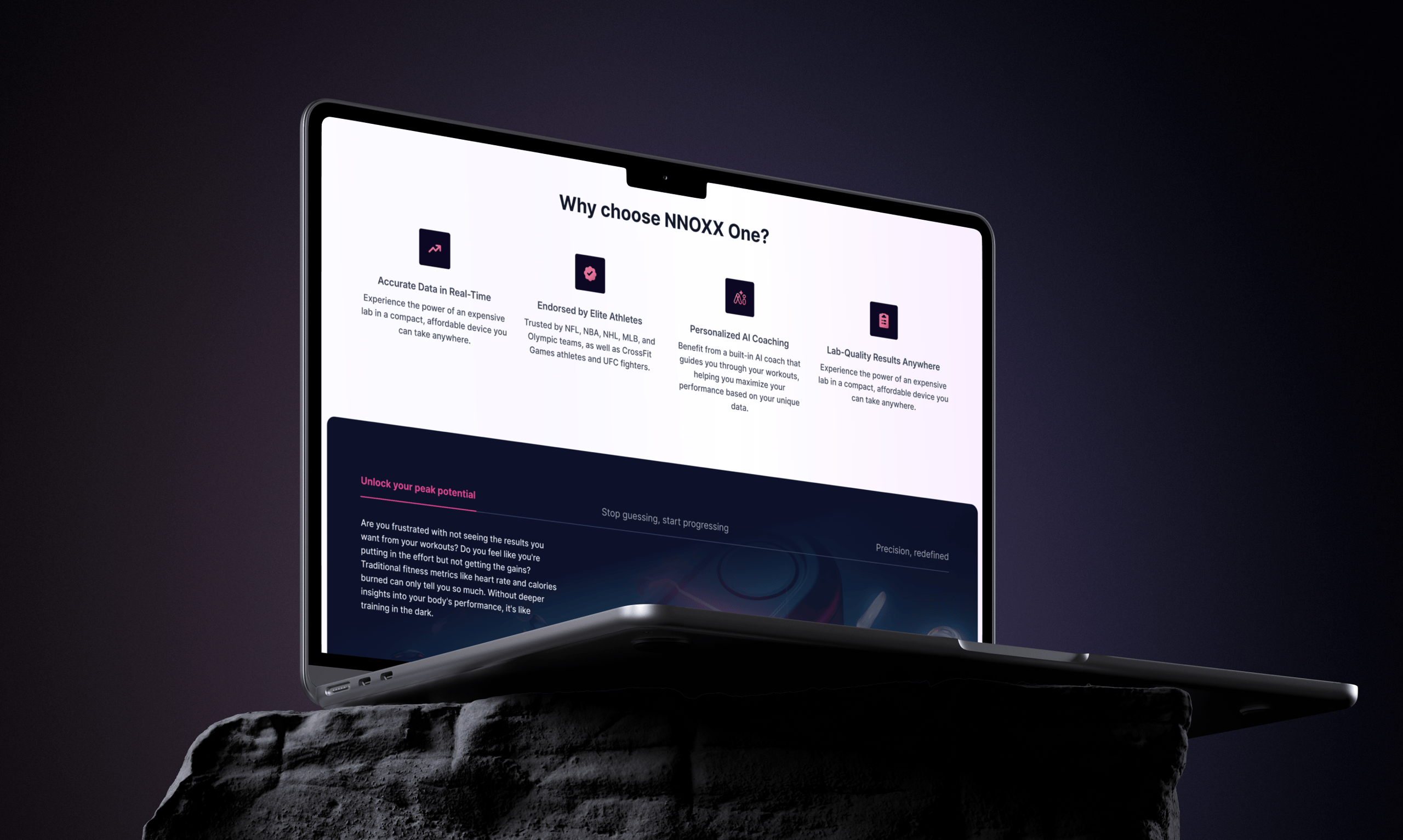 A laptop displaying the "Why choose NNOXX One?" webpage sits atop a dark textured surface against a shadowy background.